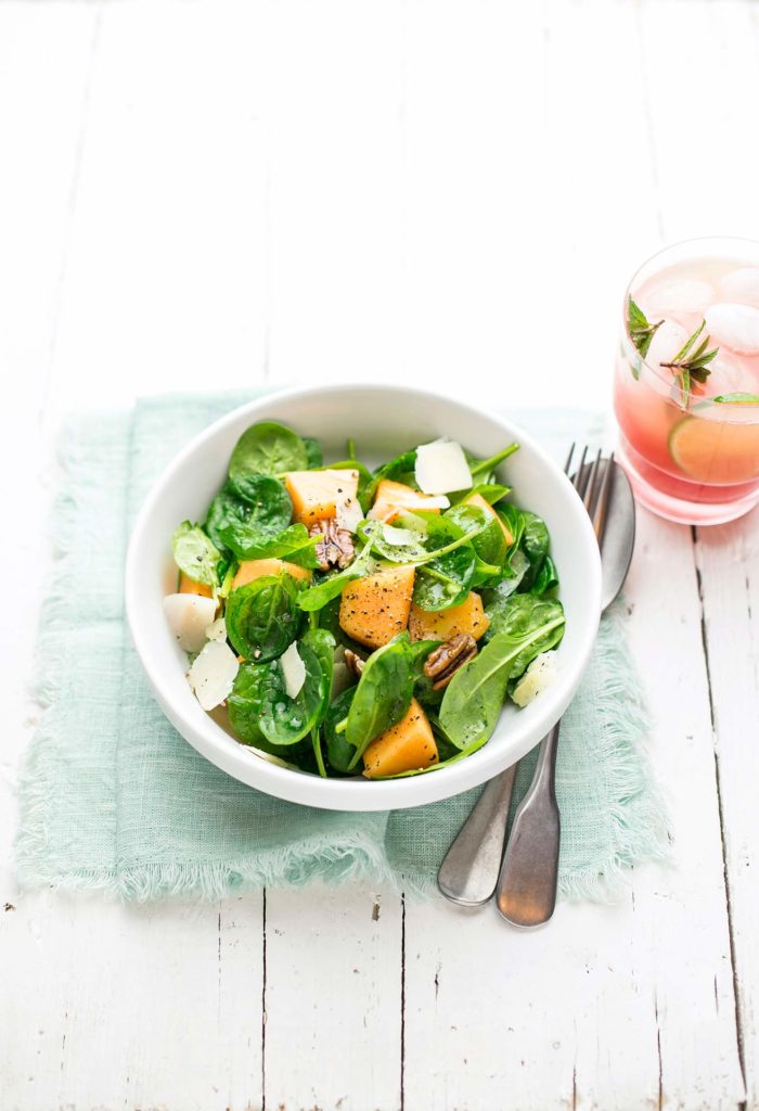 Baby spinach, melon, Parmesan cheese and pecan nut salad
